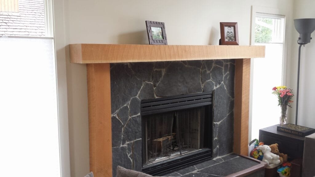 Custom maple fireplace mantel and surround with natural stone hearth