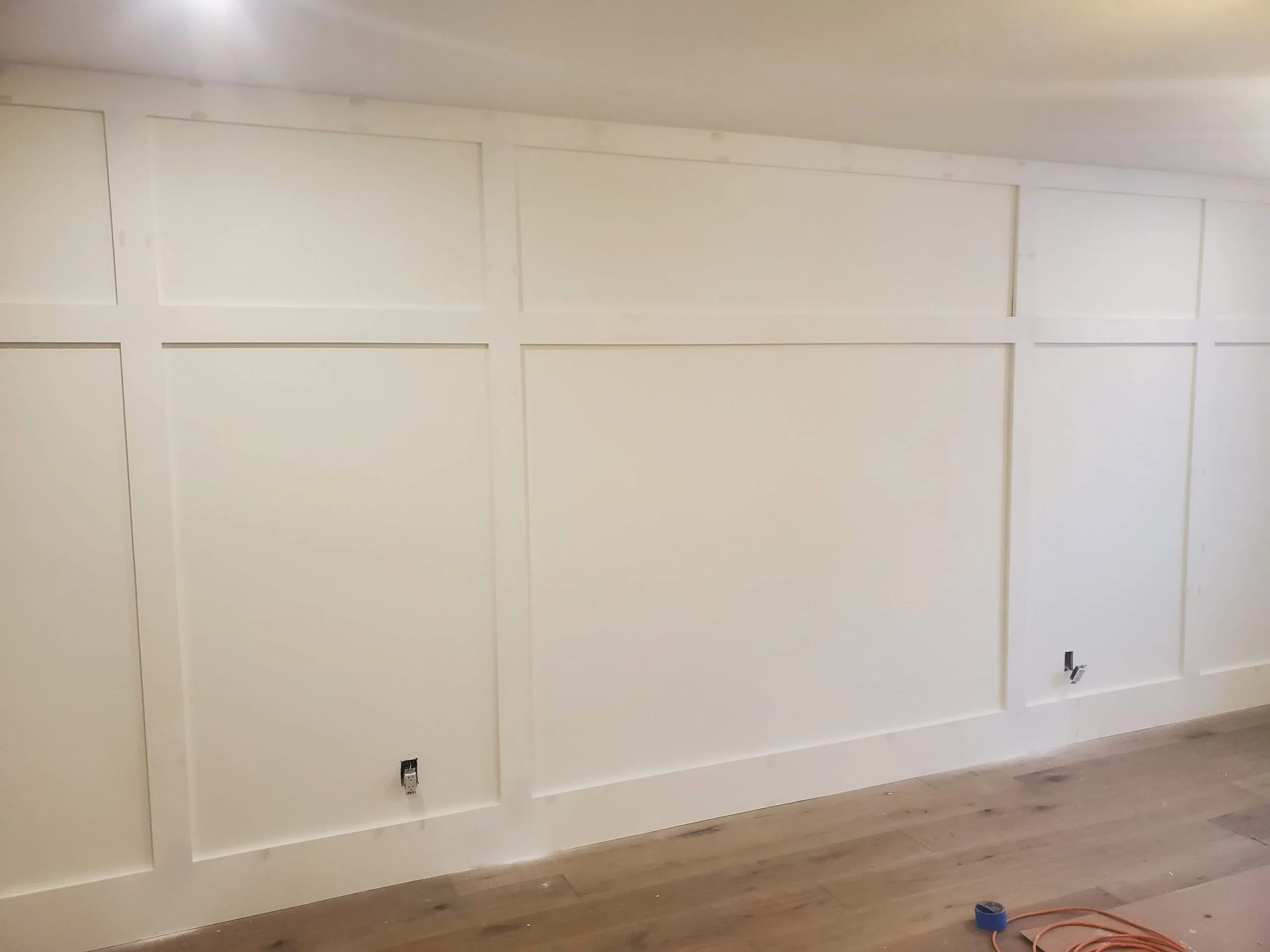 Full-height board and batten wainscoting wall treatment in Durham Region home